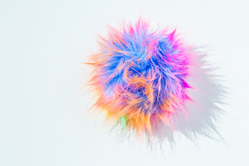 Funny colorful rainbow colors pom-pom. The challenge of everyday life and gray shades. Bright colors of life and joy concept