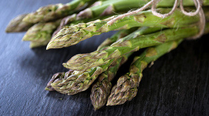  Fresh green asparagus on a stone worktop