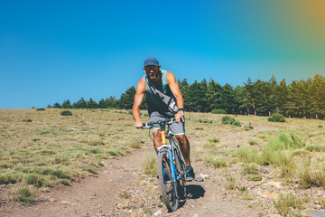 Fototapeta premium Young man rides a bicycle