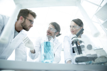 Group of scientists working on an experiment at the laboratory