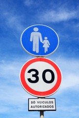 Thirty kilometre speed limit sign and pedestrian sign, Albufeira, Portugal.