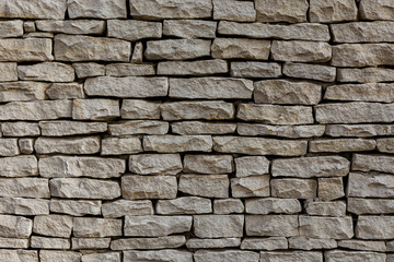 a wall of many limestone blocks of gray color