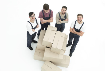 Young movers holding boxes isolated on white background,