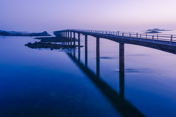 Fototapeta na wymiar The bridge on the sea