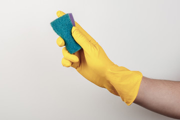 Hand in a business glove with a sponge on a white background