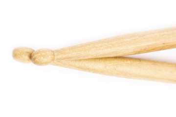 Two wooden drumsticks lying, isolated on a white background