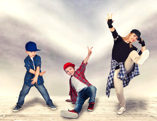 Mother and two son dance hip-hop.Urban lifestyle. Hip-hop generation.	