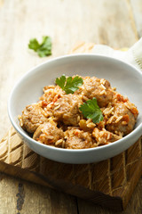 Homemade meatballs with rice, tomato and fresh parsley