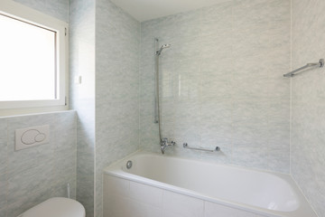 Bathroom with large tiles, retro style
