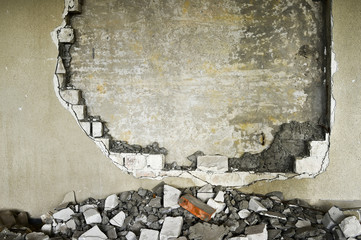 Partially destroyed wall inside an industrial building under demolition