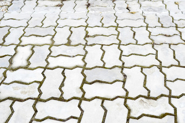 Obraz premium The texture of the tiles of the sidewalk grey stackable blocks