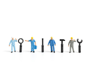 Miniature people : Worker team with tools supplies on white background