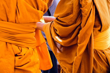 Yellow robe of Buddhist monks, Closeup on buddhist monk