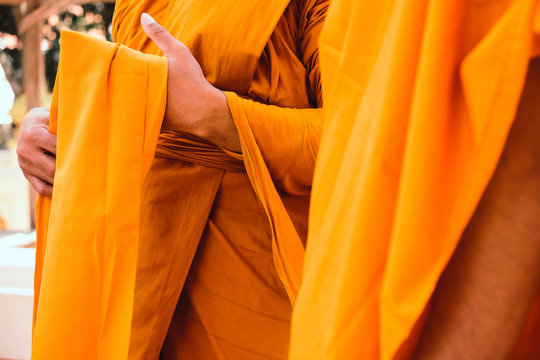 Yellow robe of Buddhist monks, Closeup on buddhist monk