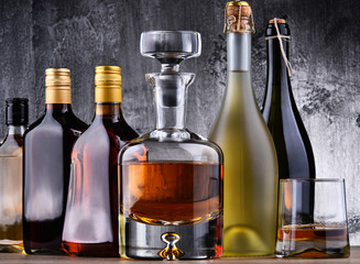 Carafe and bottles of assorted alcoholic beverages.