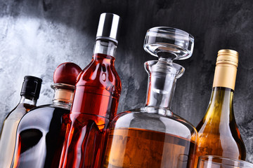 Carafe and bottles of assorted alcoholic beverages.
