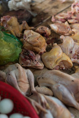 Cambodian local street food market with fresh chicken meat lies at open air