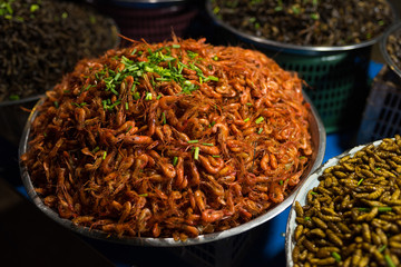 Cambodian night street food market with grilled shrimps  for sale 