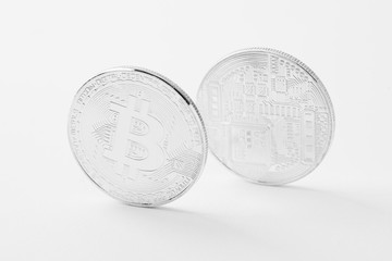 close-up shot of bitcoins on white surface
