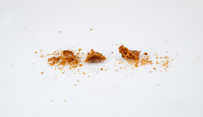 Scattered crumbs isolated on white background