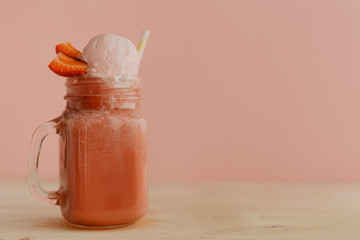 Smoothie with strawberry and straw