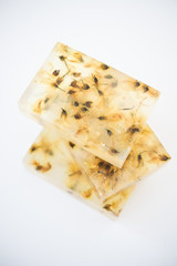 Transparent handmade soap bars with flowers and petals