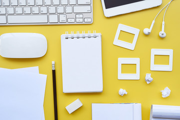 Top view of office desk table with keyboard, notebook, pencil and mouse for background