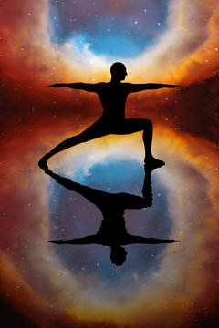 Yoga at night. Vector illustration with silhouette of yogi in pose of warrior. Abstract background with Helix Nebula