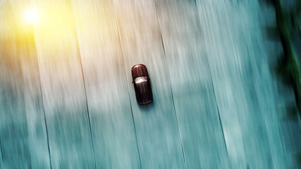 Sports car racing in motion blur – abstract background - top air view from above