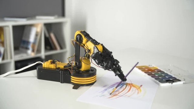 Robot Arm with Use Brush for Painting . Experiment with Intelligent Manipulator. Industrial Robot Model.