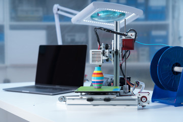 3D printer and computer on the table