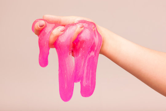 a toy for children mucus and liquid flowing on hand