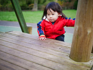 Baby girl play at outdoor playground