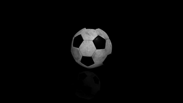 3D Animation of soccer ball over black background with reflexion