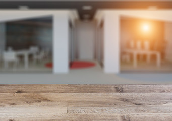 Open space office interior with like conference room . The wooden table. Blurred interior.