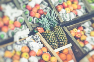 Market stall with tropical fruits and vegetables.