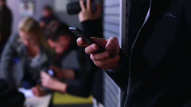 Closeup of young man hands typing sms scrolling pictures phone. HD. 1920x1080