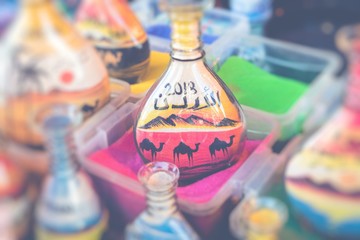 Souvenirs from Jordan - bottles with sand and shapes of desert and camels.