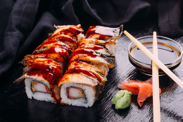 Sushi roll served with wasabi and ginger