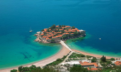 Fototapeta na wymiar Sveti Stefan island in Budva in a beautiful summer day, Montenegro. Beautiful destinations.