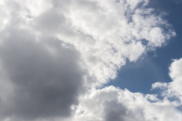 Cumulus clouds in a blue sky.