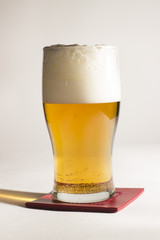 Beer in glass mug isolated on white background