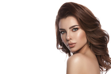 Naklejka premium Beauty portrait of a young girl with natural make-up and natural lip color. Hairstyle curls, chestnut hair color. White isolated background.