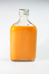 milk tea in glass bottle on white background