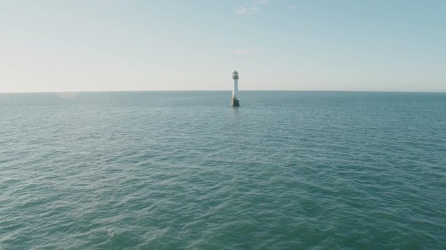 Aerial drone shot of Bell Rock Lighthouse near the coast of Arbroath