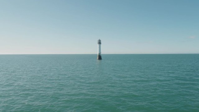 Aerial drone shot of Bell Rock Lighthouse near the coast of Arbroath