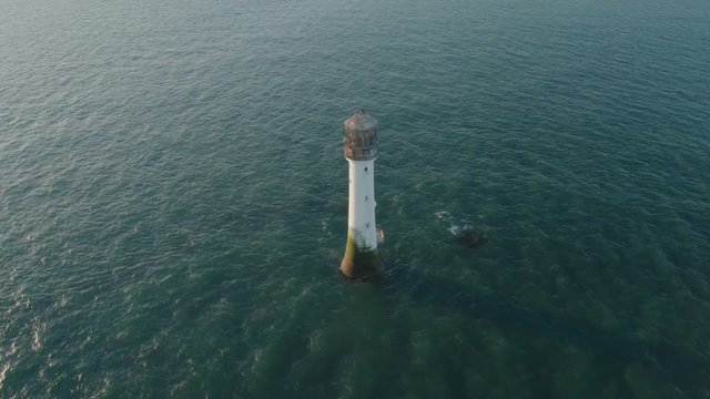 Aerial drone shot of Bell Rock Lighthouse near the coast of Arbroath
