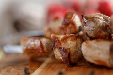 Shish kebab from pork closeup. Juicy meat cooked on an open fire. Rustic.