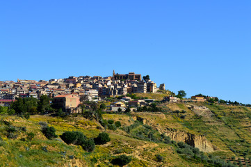Fototapeta na wymiar View of Mazzarino with the Maria Santissima del Mazzaro Sanctuary in the Background, Caltanissetta, Sicily, Italy