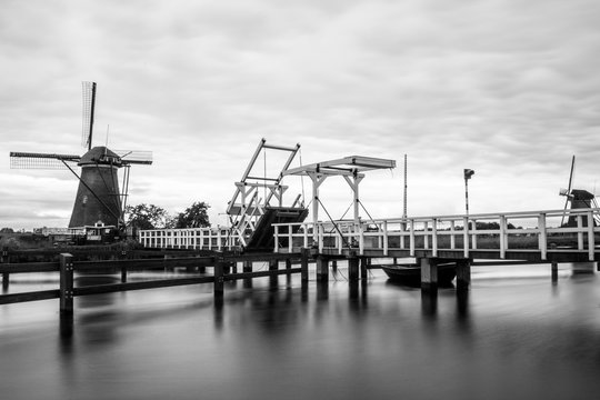 Black and white windmill with drawbridge